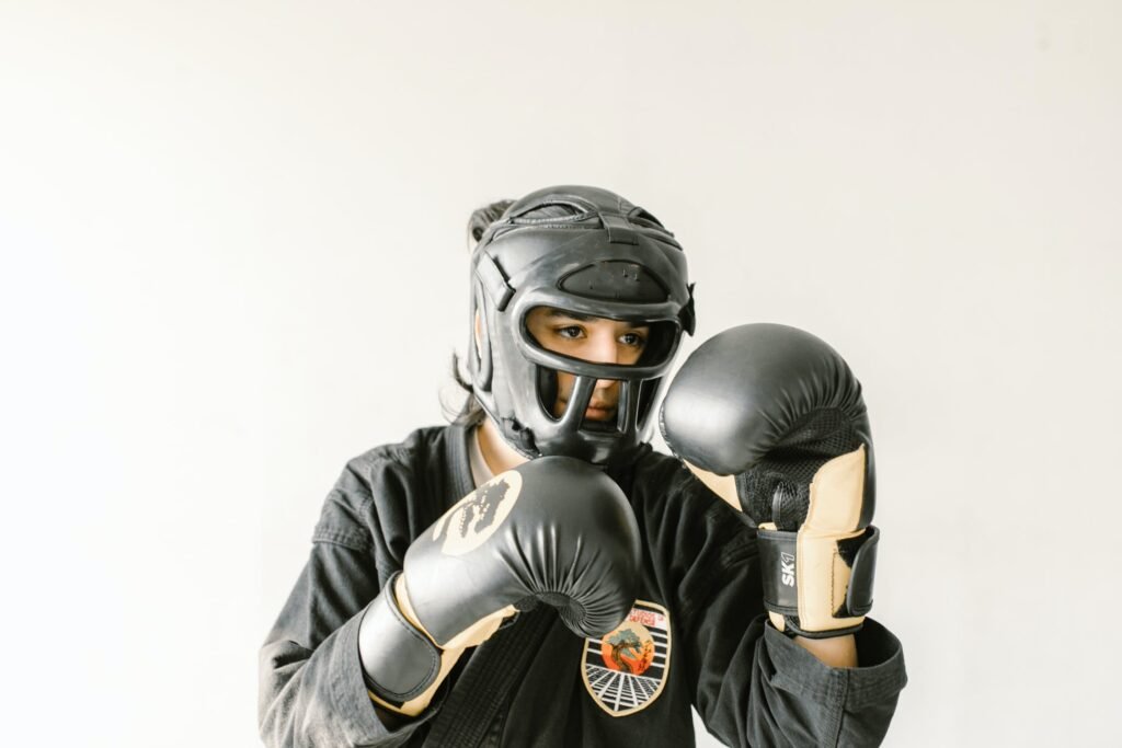 a boy with taekwondo equipment