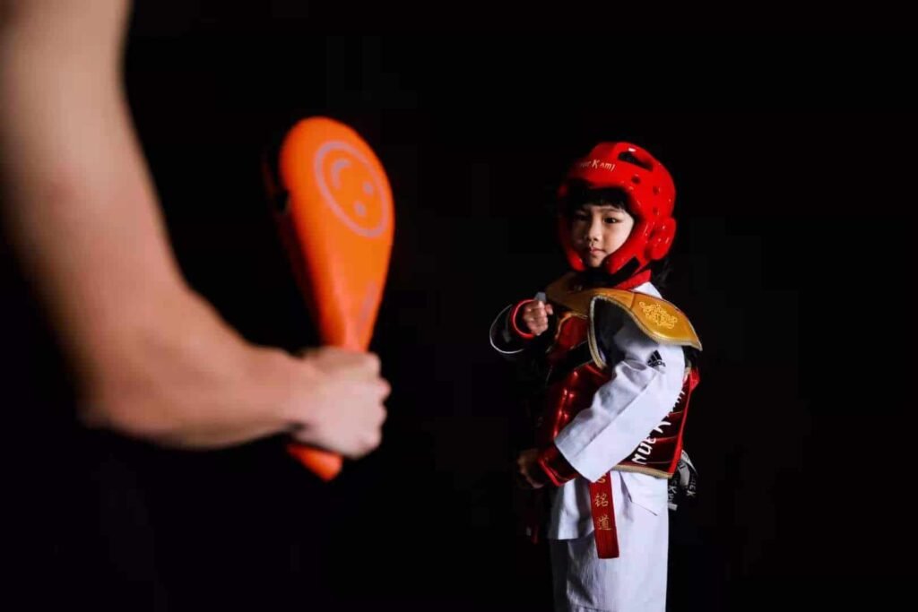 a boy with taekwondo equipment 3