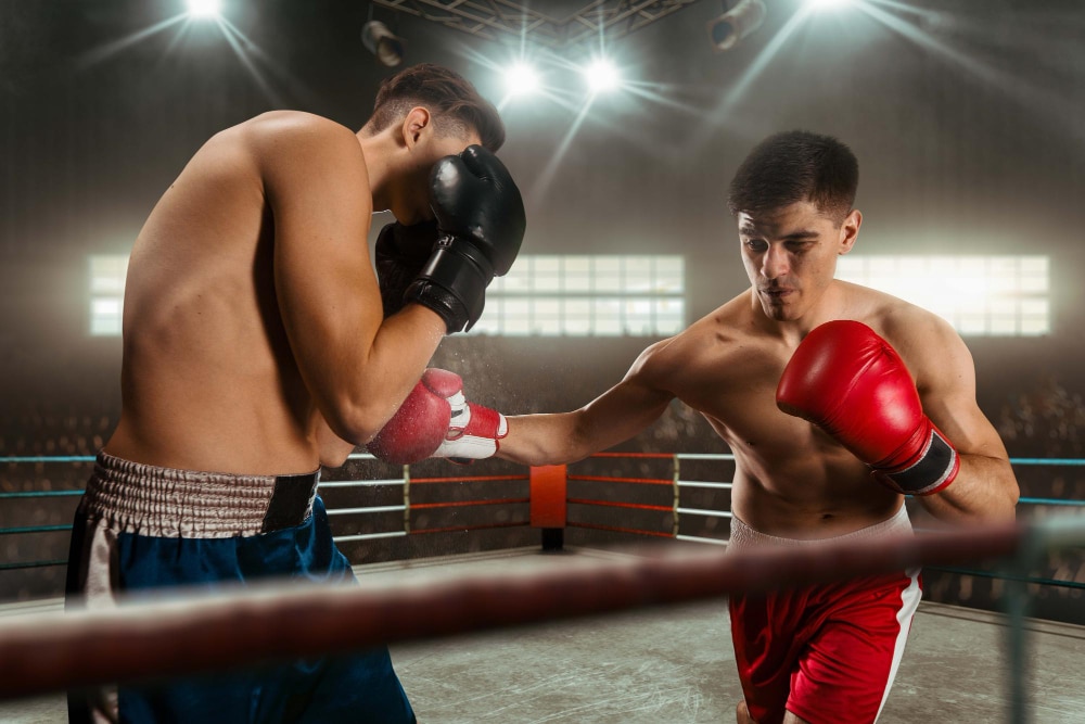 Image of two male boxers battling 