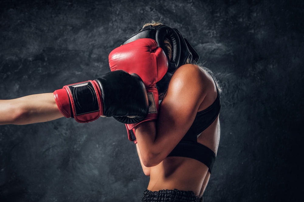 an image of  woman using boxing equipment
