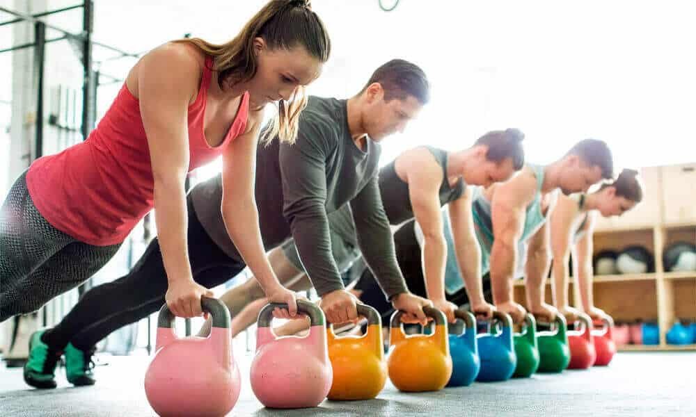 People ready to do kettlebell exercises for kettlebell benefits