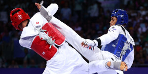 Taekwondo athletes wearing full protective TKD gear