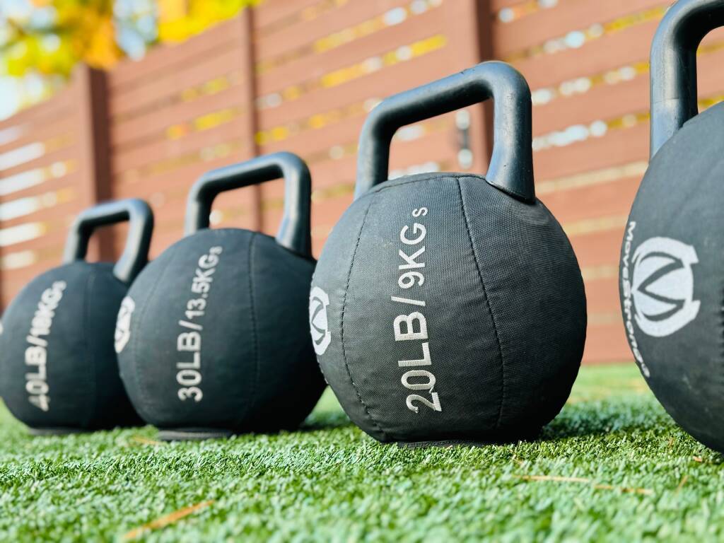 Padded kettlebell set on a lawn