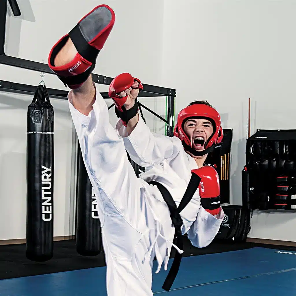 An athlete wearing TKD wear ready to kick