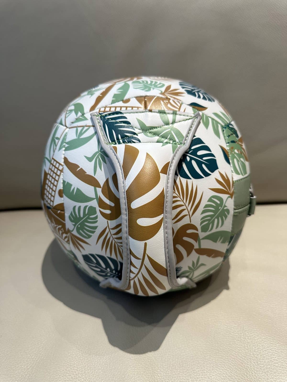 Back lacing detail on custom handle wall ball with patterned synthetic surface