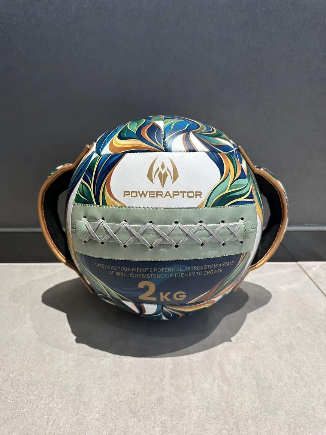 Custom 2 kg handle wall ball with Poweraptor logo and front lacing