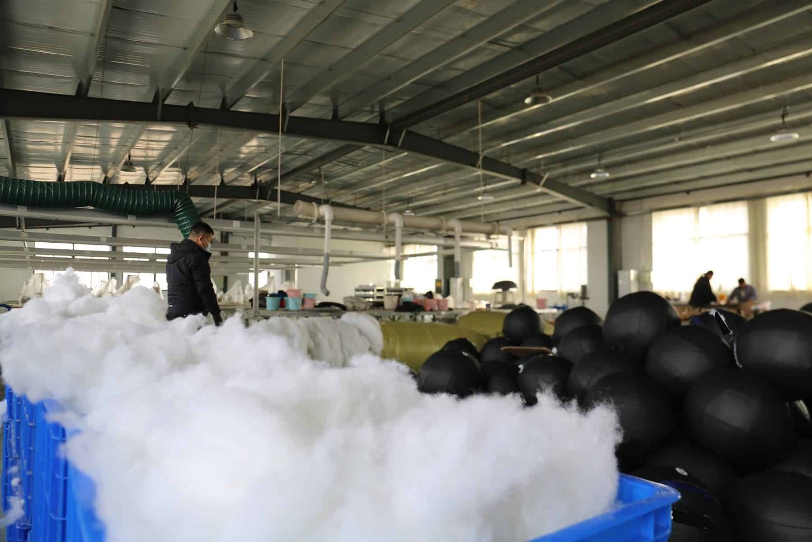 Workshop view of polypropylene cotton filling used in wall ball production planning